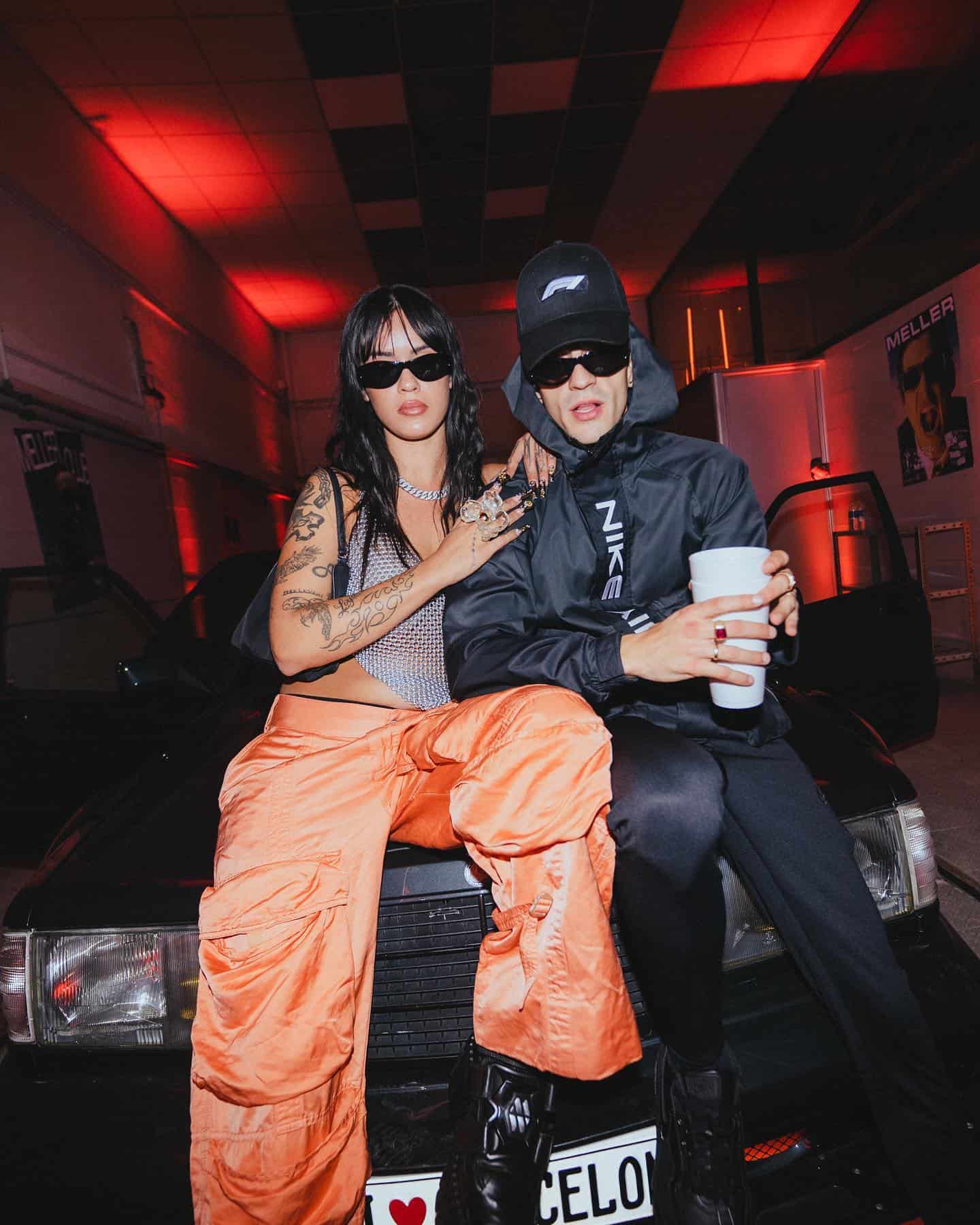 couple wearing sunglasses inside a dark room