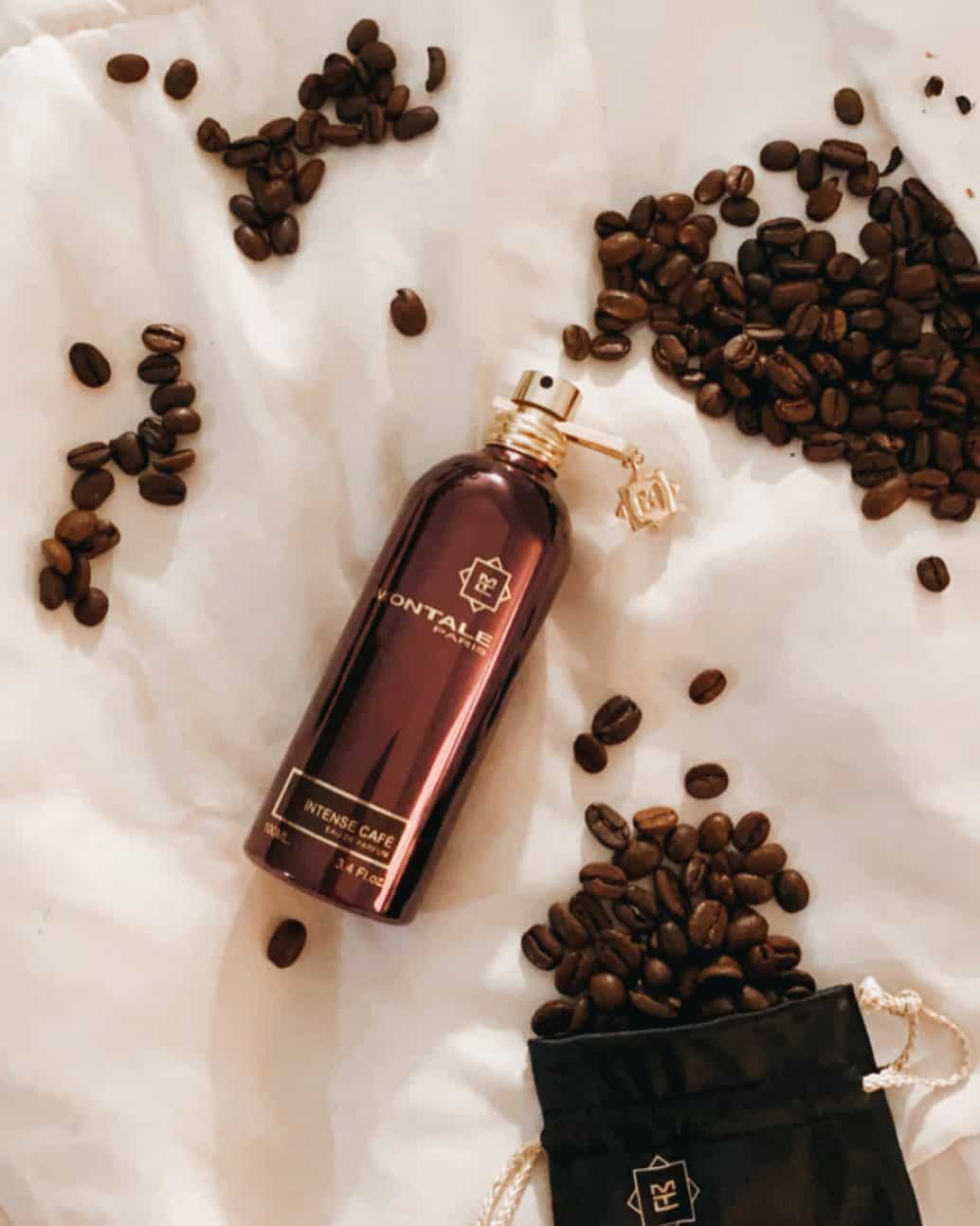 a bottle of montale intense cafe surrounded by coffee beans