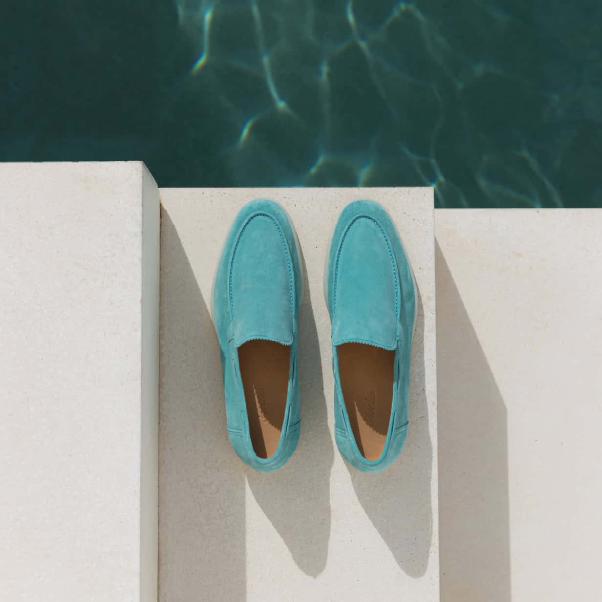 a pair of pastel blue suede yacht loafers by aurelien