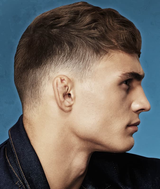 Men's short cropped haircut with a taper fade