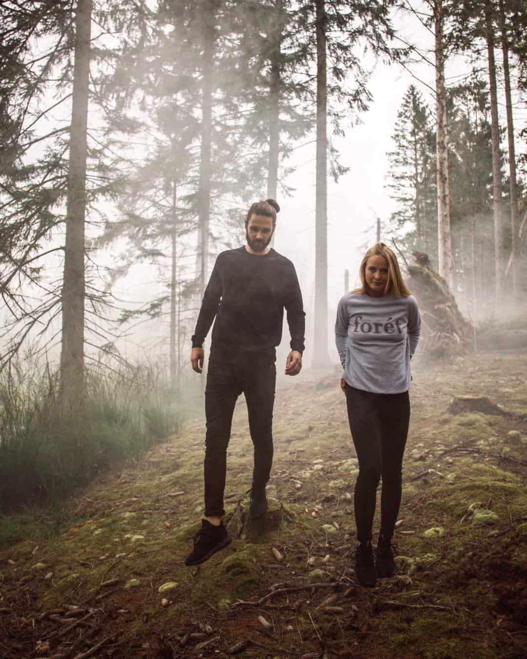 couples walking in a foggy woods