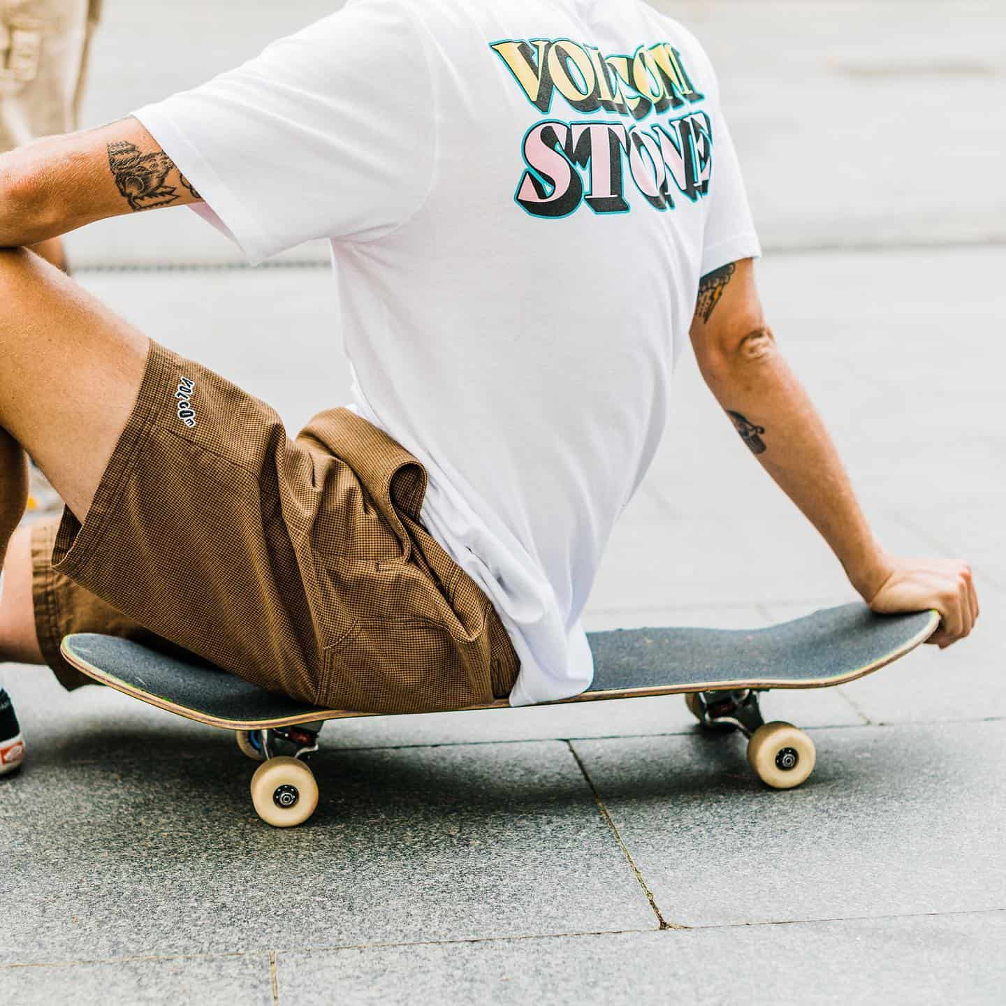 man sittting on a skate board